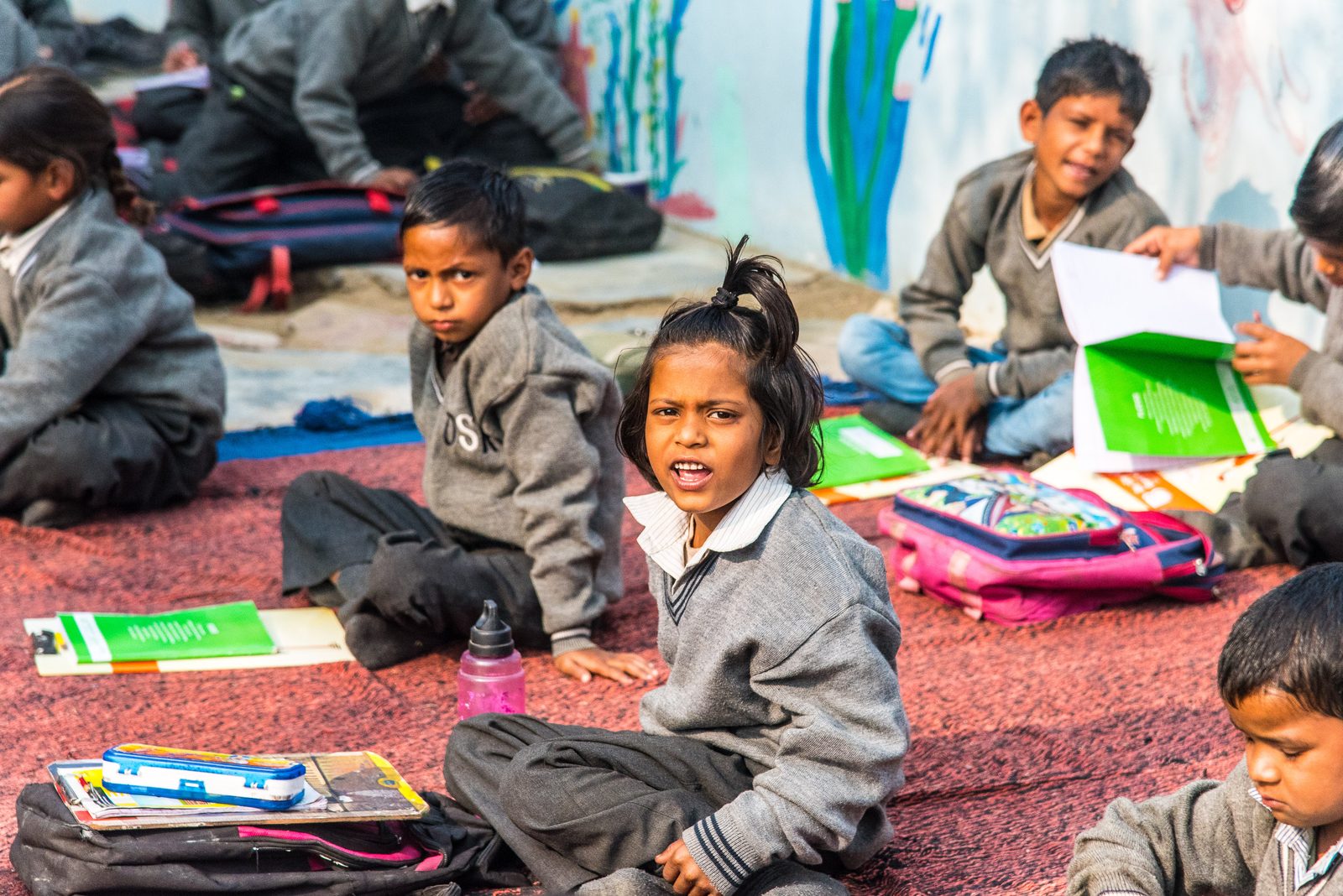 Children with their notebooks at an open-air class